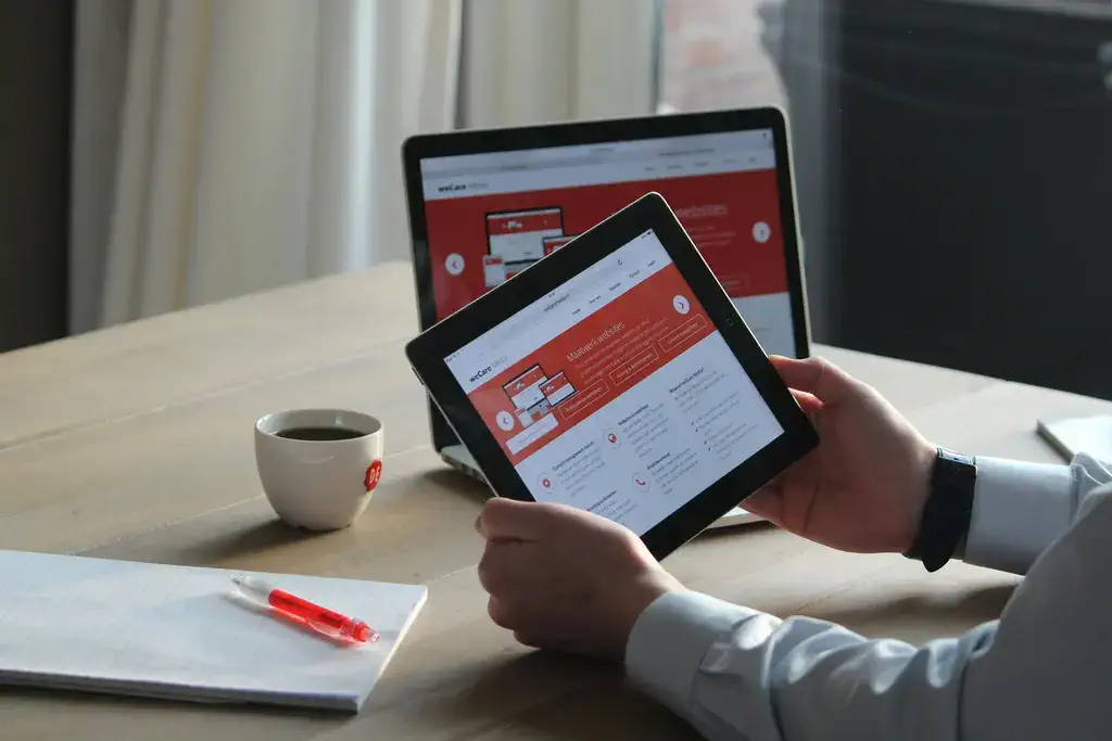 Modern website design displayed on desktop, tablet, and mobile devices showing responsive layout