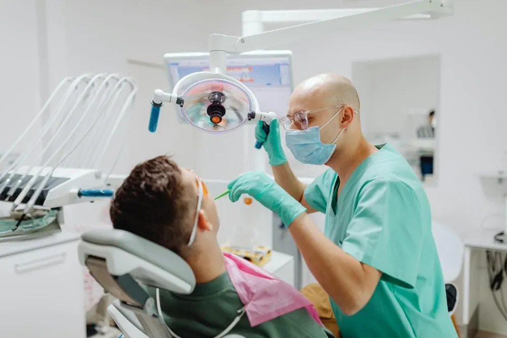 Dentist examining a patient in a modern dental office